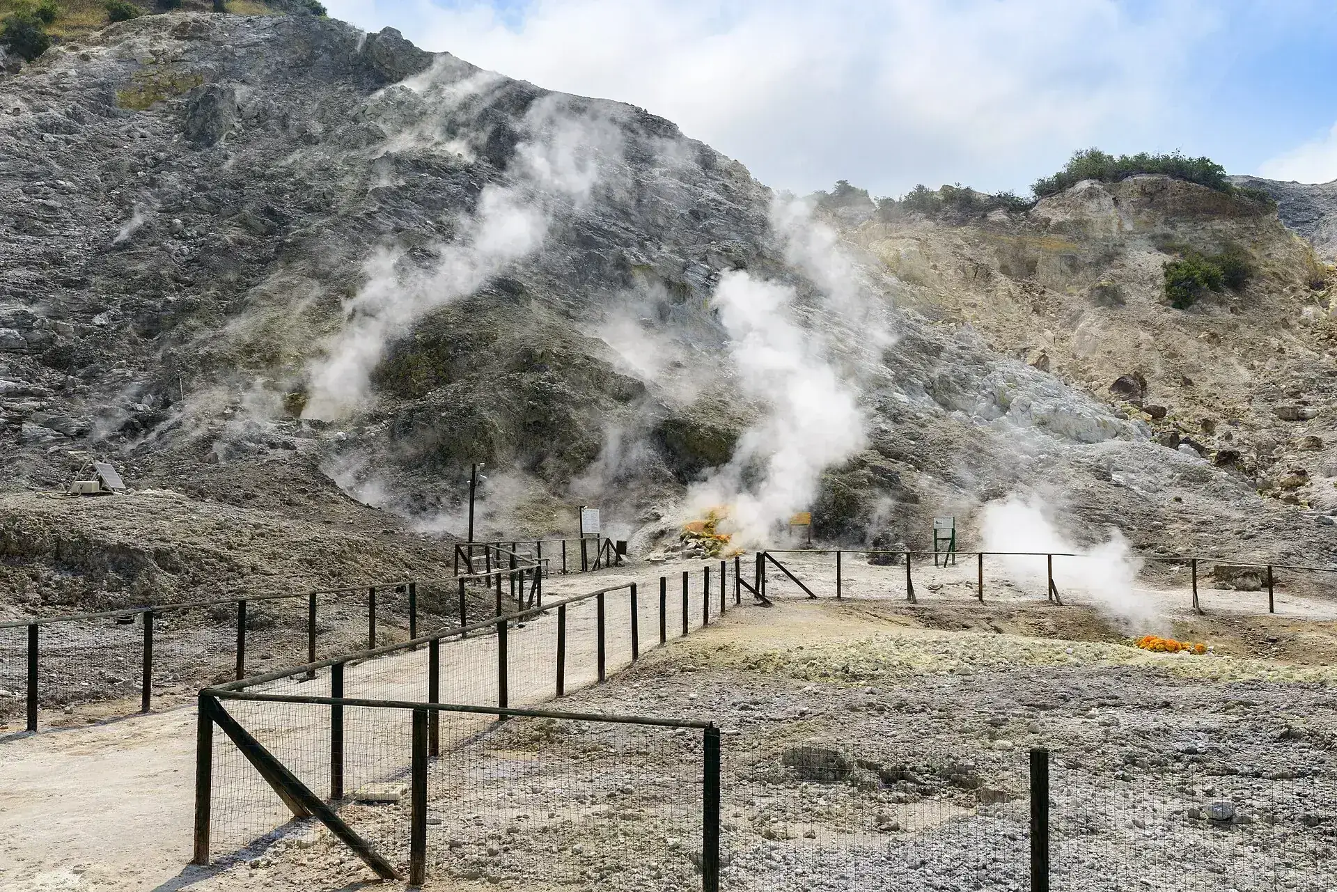 Steaming fumaroles behind wooden fences in the Solfatara crater at Pozzuoli, Campi Flegrei