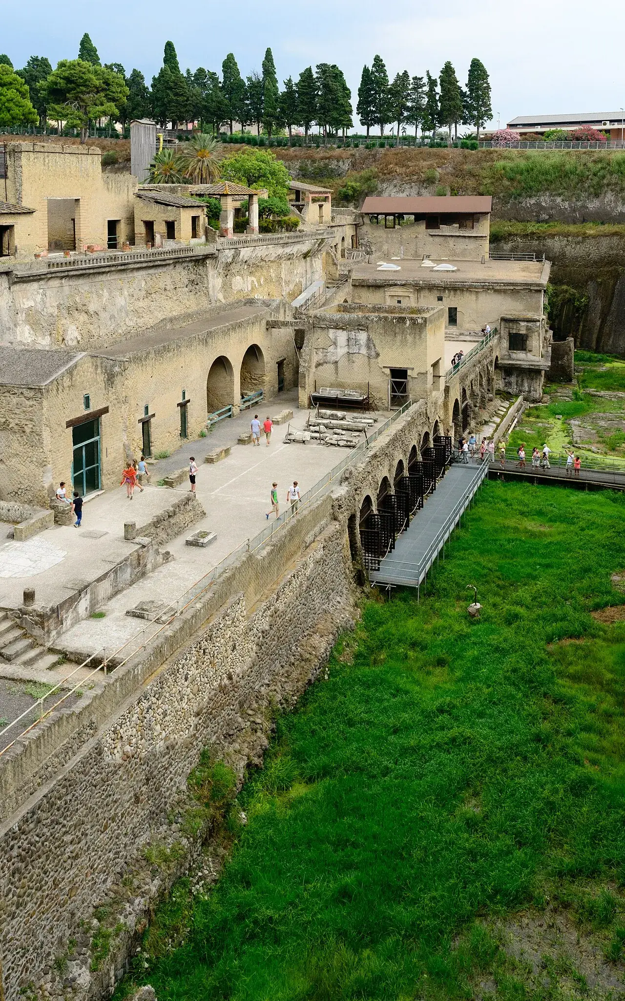 View from the modern town of Ercolano down into the Herculaneum excavations: Roman houses far below street level