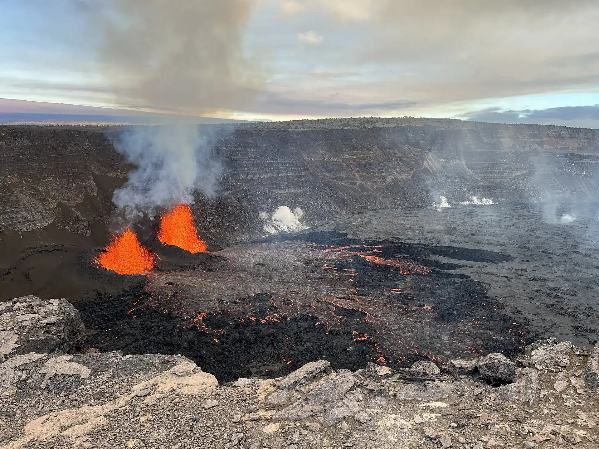 Two lava fountains on the floor of Halemaʻumaʻu crater during episode 4 on January 16, 2025, seen from the south rim of the caldera