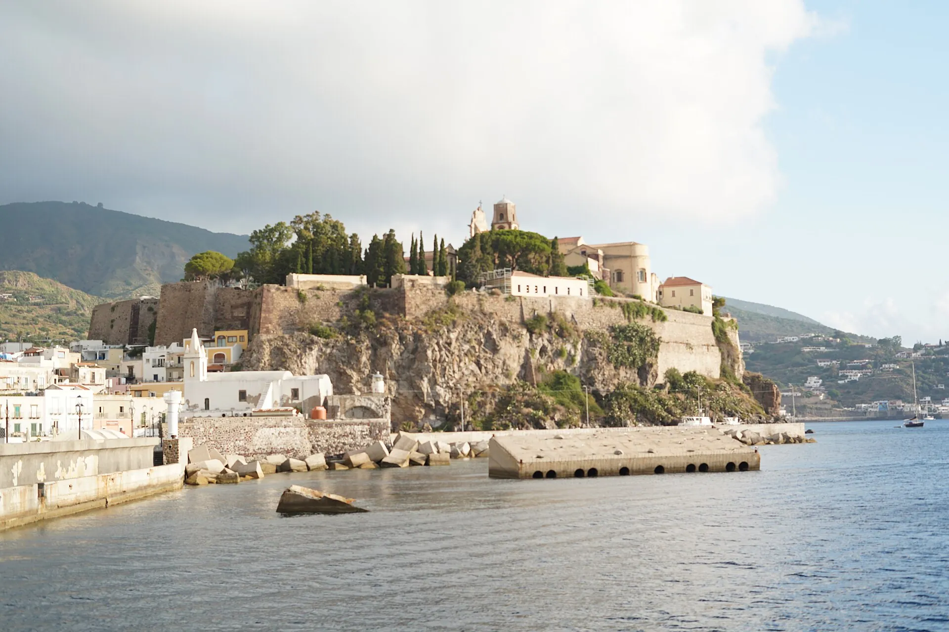 The Castello of Lipari on its rock above the Marina Corta harbour, the mole and white houses in front