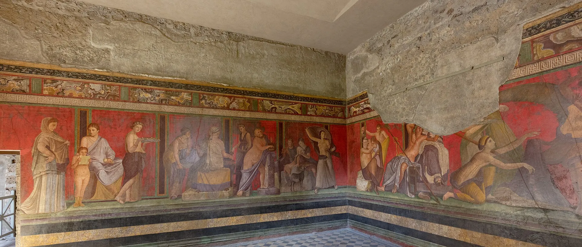 Red-ground frescoes in the Villa of the Mysteries at Pompeii showing life-size figures