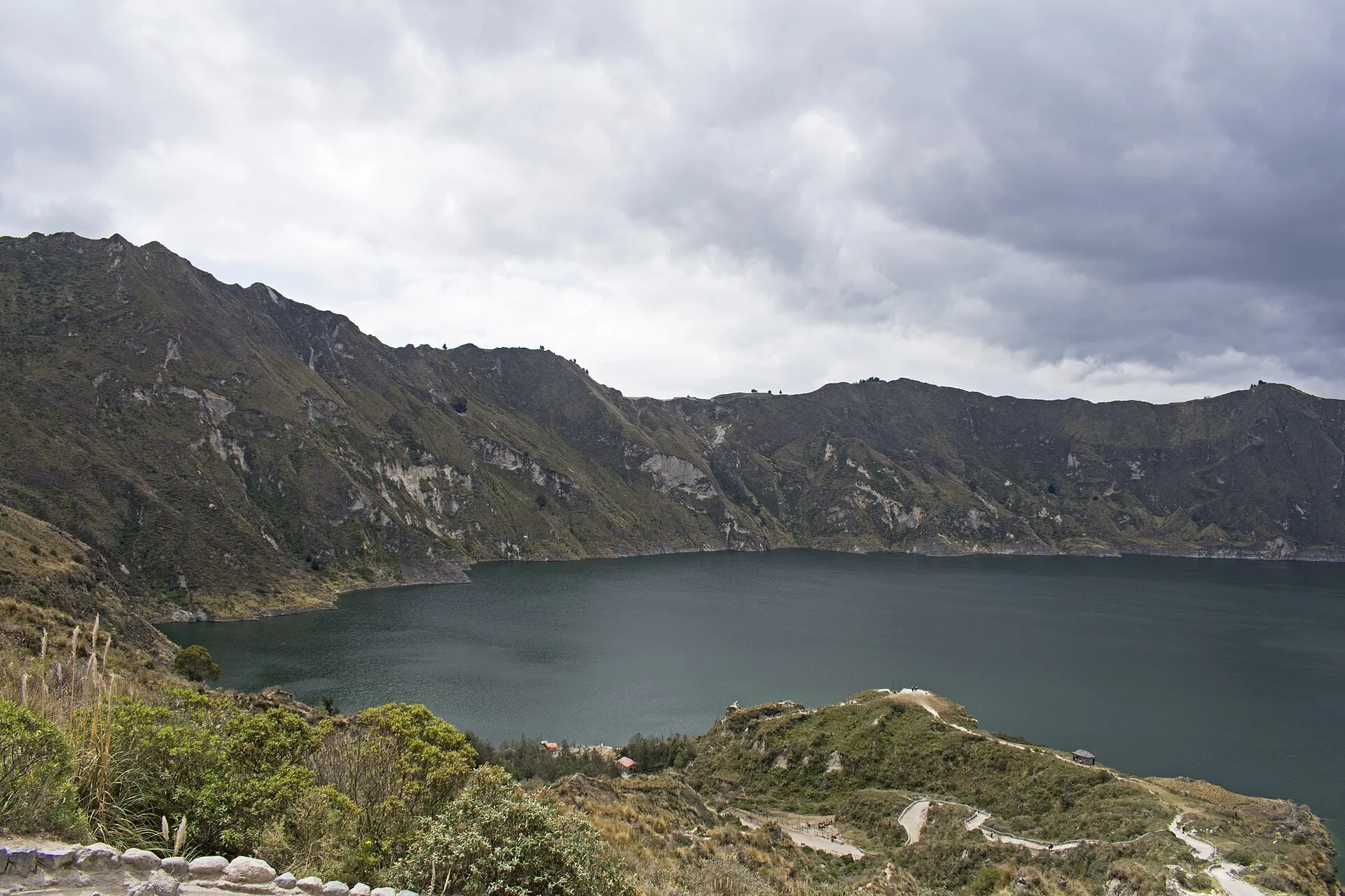 The sandy zigzag trail down to Laguna Quilotoa, the lake gray-green under clouds