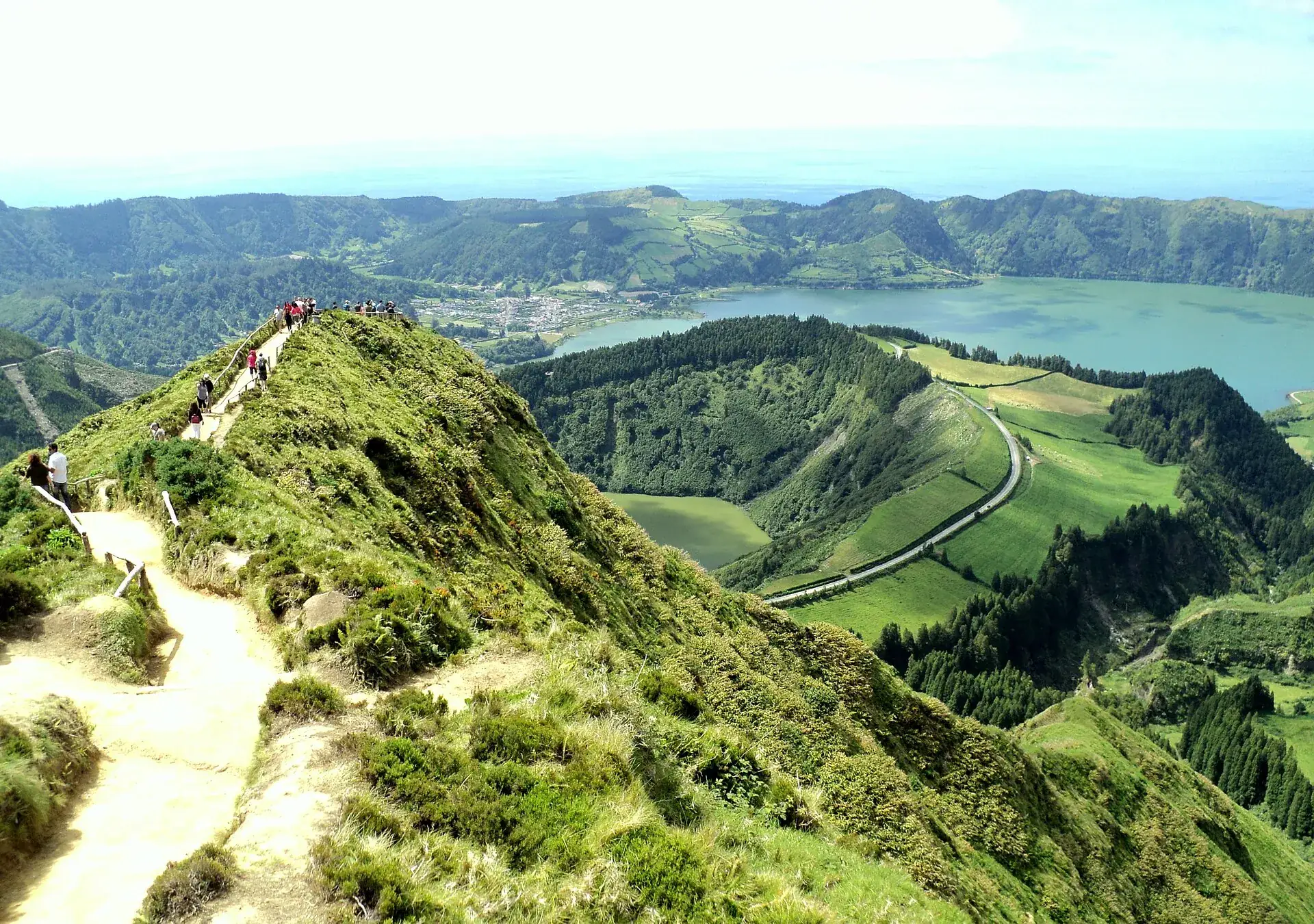 View from the Boca do Inferno viewpoint over Sete Cidades: Lagoa de Santiago in its small crater, the twin lakes and the village behind